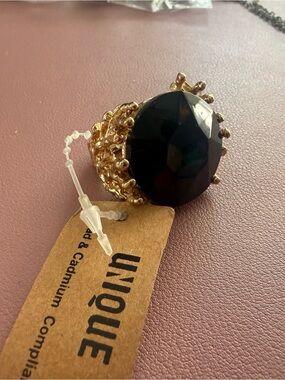Unique Gold-Tone Statement Ring with Large Black Gem